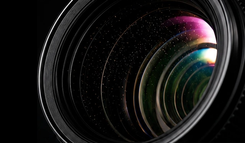Camera lens inspected for internal dust