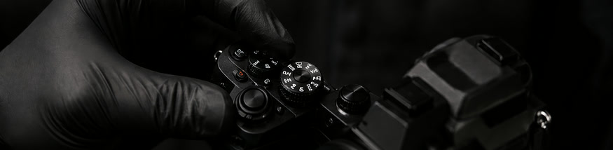 Technician checking camera dials