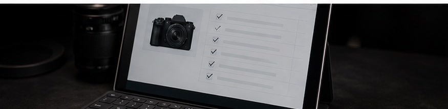 Digital inspection checklist displayed beside camera gear