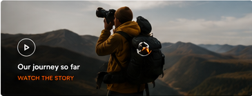Our journey so far — a photographer overlooking a mountain landscape